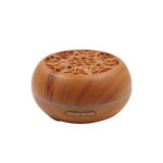 an electric scent diffuser in light wood color