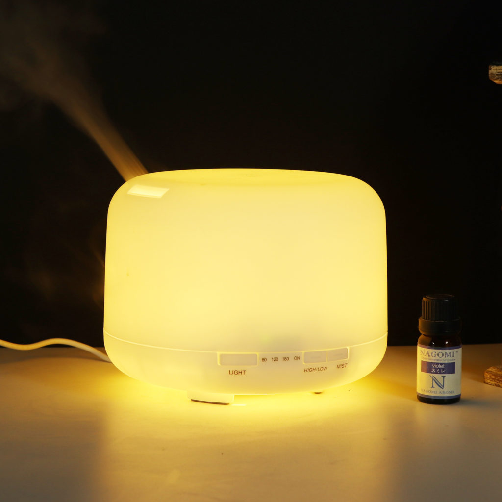 a muji essential oil diffuser is working in the darkness