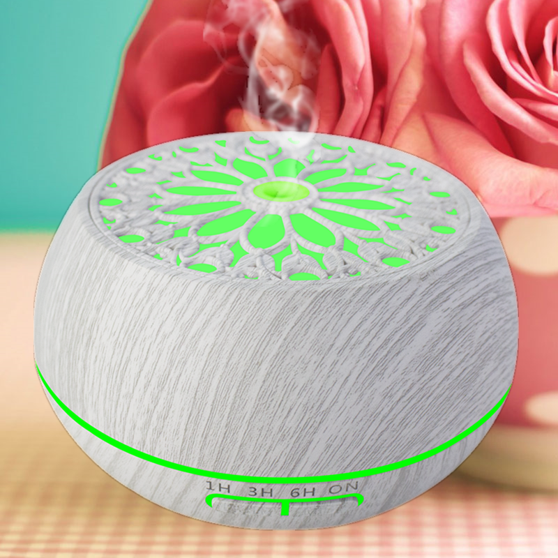 an electric aromatherapy diffuser in white wood color