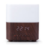 a wood base aroma diffuser with bluetooth speaker