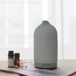 a white color ceramic electric diffusers on the desktop