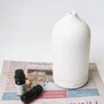 a white color ceramic electric diffuser on the desktop