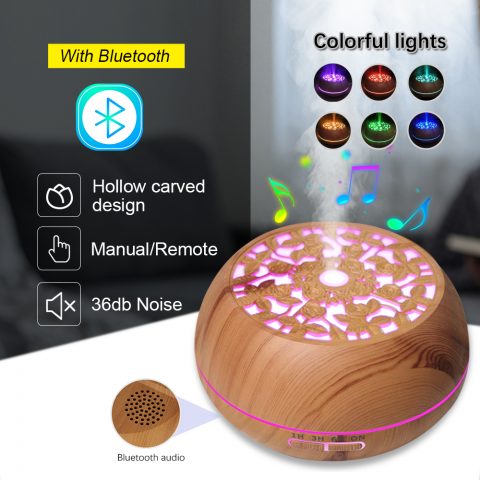 A wood color aroma diffuser with bluetooth music playing