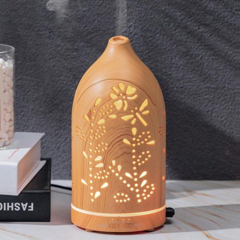 a hollow design aroma diffuser is working with soft mist